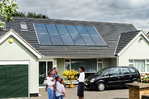 Happy Family In Front of New Home